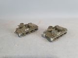 two toy tanks that are sitting on a table