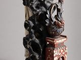 a statue of a woman holding a bird on a table