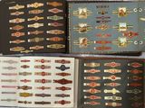 several different types of cigars are in a book on a bed