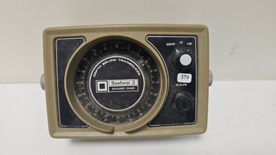 an old fashioned radio sitting on a white table