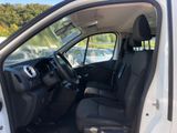 the interior of a white van with the door open