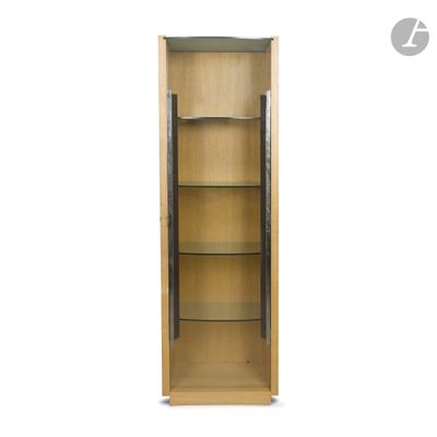 a close up of a tall wooden cabinet with glass shelves