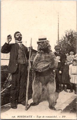 a man standing next to a bear with a cane