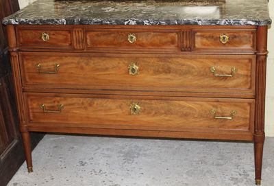 a dresser with a mirror on top of it