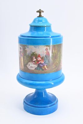 a blue vase with a painting on it sitting on a pedestal