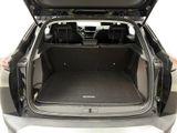 the back of a car with the trunk open and the seats folded down