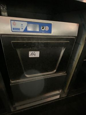 a silver oven with a number on it in a kitchen