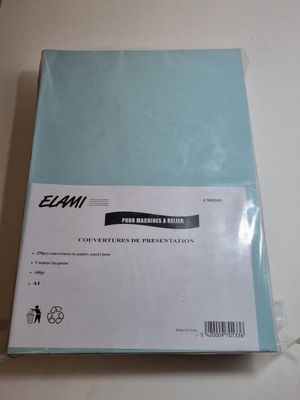 an empty blue binder sitting on top of a white table