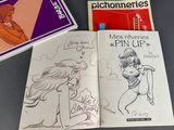 three books that are sitting on a table