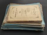 a stack of old papers sitting on a table