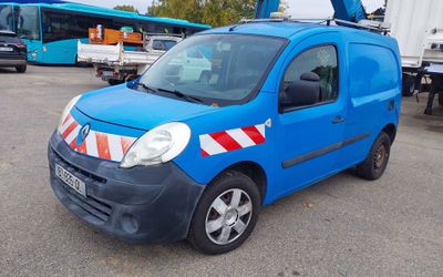 a blue van that is parked in a parking lot