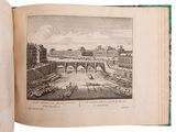 an open book with a picture of a bridge in the background