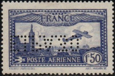 a close up of a stamp with an airplane flying over a city