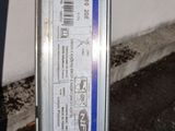 a blue and white sticker on the side of a pole