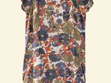 an image of a women ' s top with flowers on it