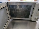a microwave that is sitting on a counter in a kitchen