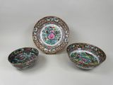 three chinese porcelain bowls and a saucer