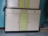 an old fashioned refrigerator in the corner of a room
