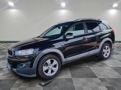 a picture of a black suv parked in a garage