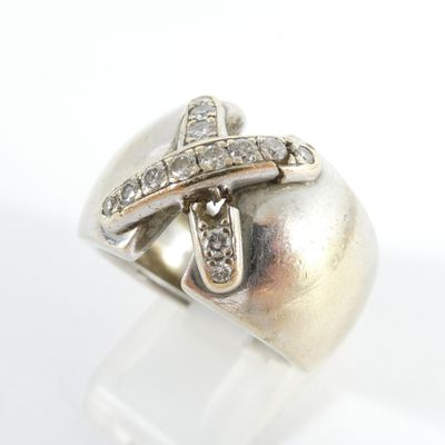 an image of a silver ring with diamonds on a white background