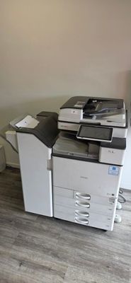 a photo of a printer sitting on top of a desk