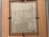 a picture of a picture hanging on a wall in a glass case