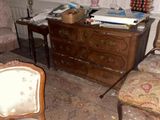 an image of a messy living room with a lot of clutter