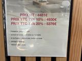 a sign on the door of a store telling people to buy furniture