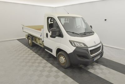 a picture of a white truck parked in a garage