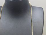 a close up of a necklace on a mannequin neck