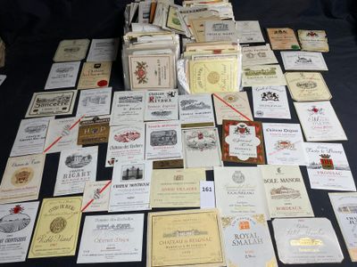 many different types of wine labels on the table