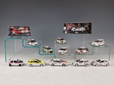 a lot of cars that are on display in a display case