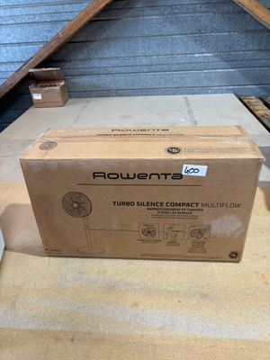 boxes are stacked on the floor next to a box of toilet paper