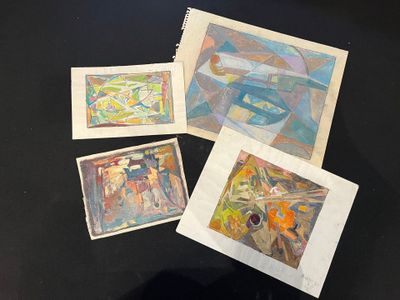 four paintings of different shapes and sizes on a black surface