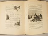 an open book with pictures of mountains on it