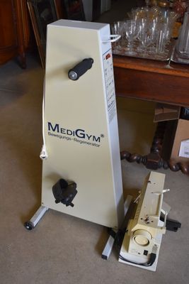 a machine that is sitting on the floor next to a table