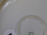 a white plate with a number on it sitting on a table