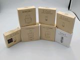 several boxes stacked on top of each other on a white surface