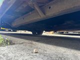 a close up view of a car ' s rear end on the road