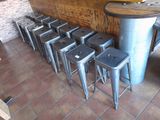 a lot of stools and a table in a room