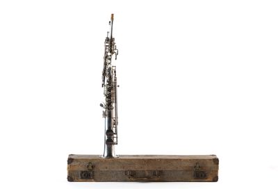 a bassoon sitting on top of a piece of wood