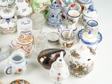 many different types of vases and bowls on the table