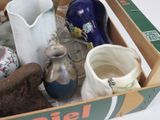 a box with a variety of vases in it