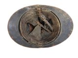 an old rusty helmet with a broken visor on it