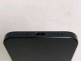 a close up of the back of a black iphone
