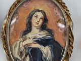 two miniature paintings of a woman holding a baby in a gold frame