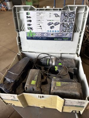 a box full of tools that are sitting on the floor