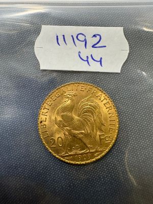 a close up of a coin in a plastic bag on a table