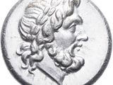 a close up of a silver coin with a man ' s face on it