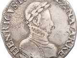 a close up of a silver coin on a white background